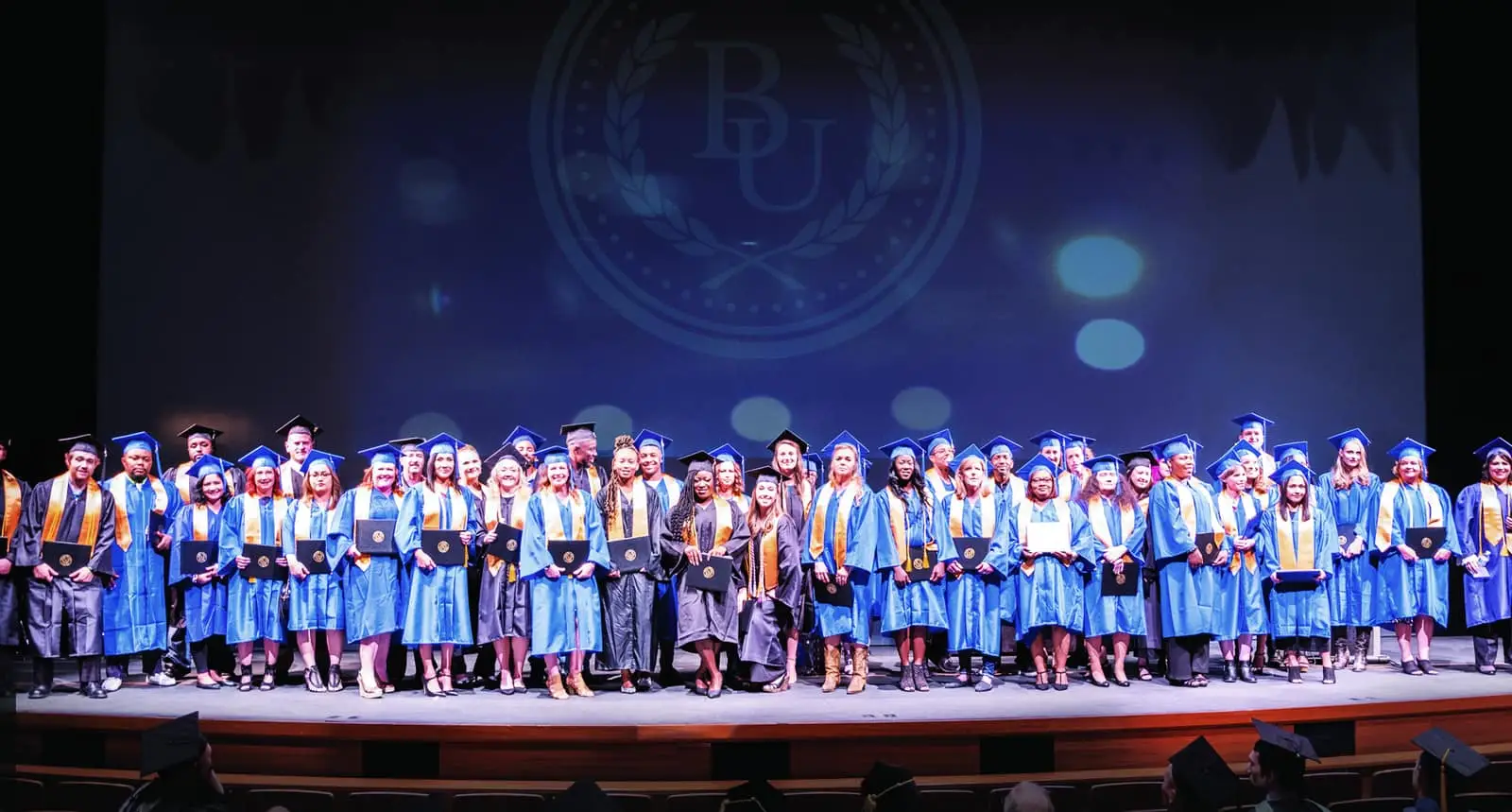 BU Grads on stage