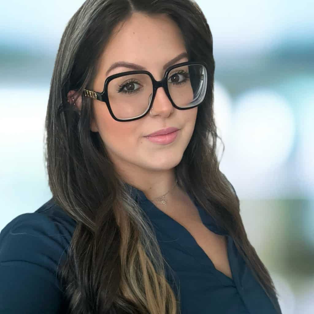 Behind the Scenes at Bryan University: Financial Aid Analyst Alex LaFlam 1 A smiling woman wearing glasses