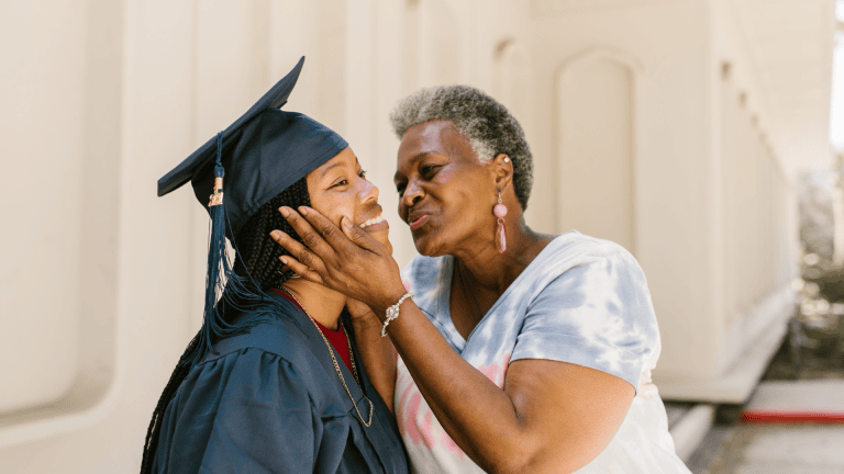 A family member celebrating with a graduate