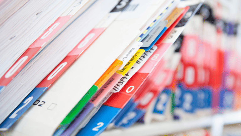 a row of medical records on a shelf