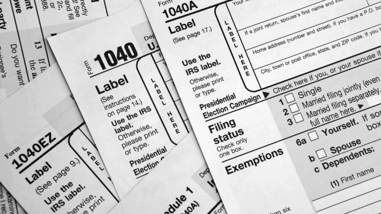 a pile of tax forms is shown in black and white