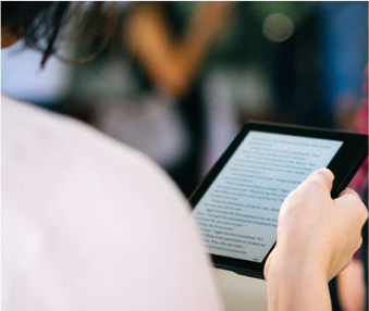 student holding ereader device