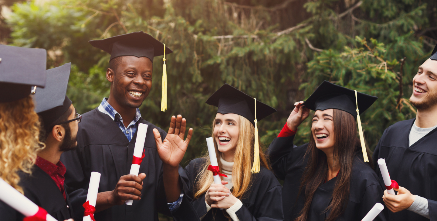 graduates in a group with diplomas