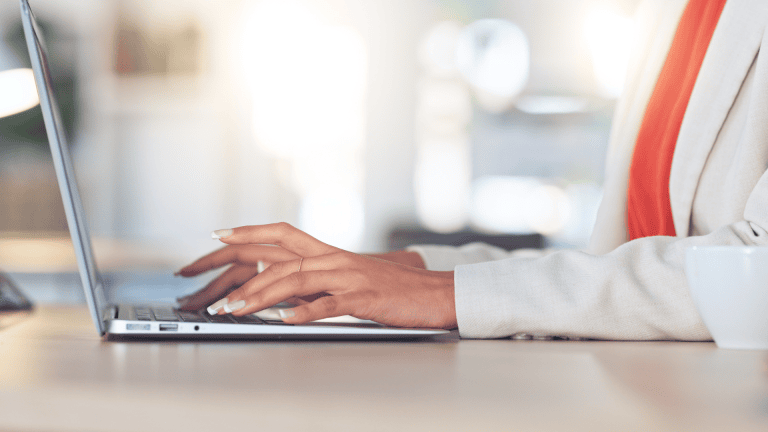 A person typing on a computer